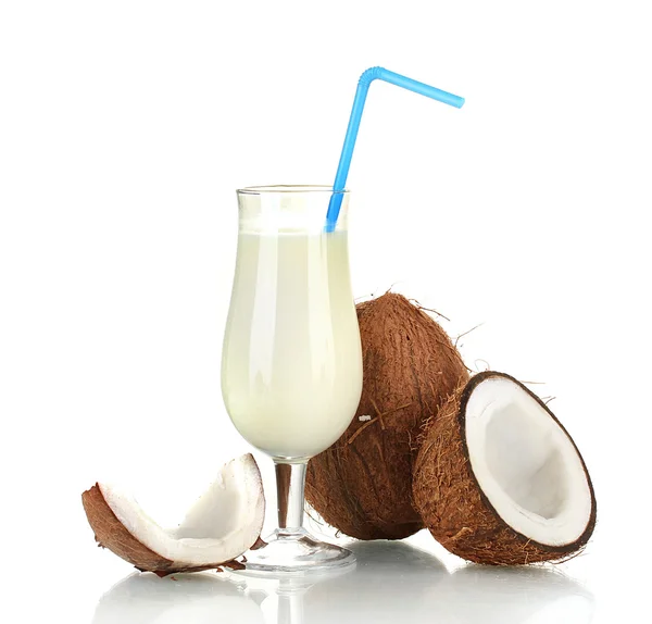 Glass of coconut milk and coconuts isolated on white — Stock Photo, Image