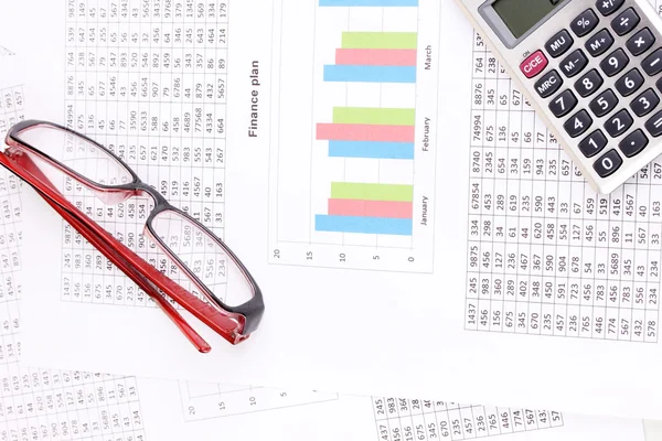 Documents, calculator and glasses close-up — Stock Photo, Image