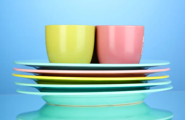 Color plates on blue background — Stock Photo, Image