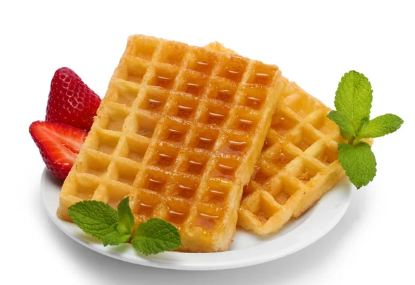 Belgium waffles with honey, strawberries and mint on plate isolated on white — Stock Photo, Image