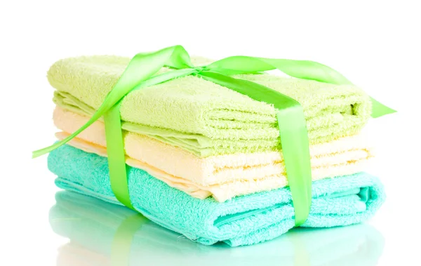 Colorful towels with ribbon isolated on white — Stock Photo, Image