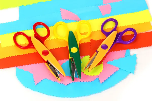 Colorful zigzag scissors with color paper isolated on white — Stock Photo, Image