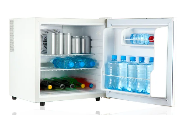 Mini fridge full of bottles and jars with various drinks isolated on white — Stock Photo, Image