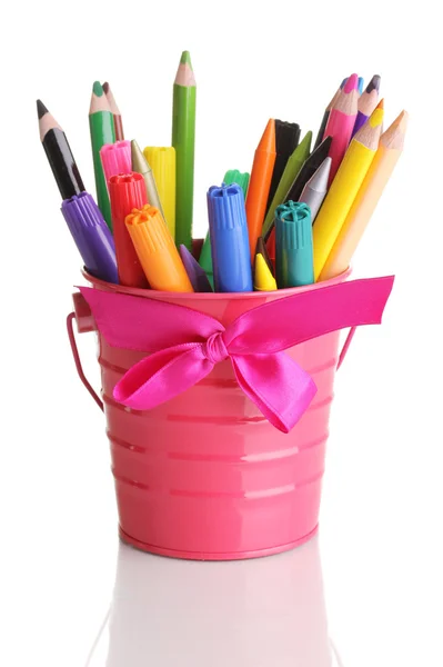 Colorful pencils and felt-tip pens in pink pail isolated on white — Stock Photo, Image