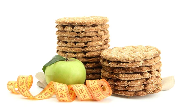 Tasty crispbread, apple and measuring tape, isolated on white — Stock Photo, Image