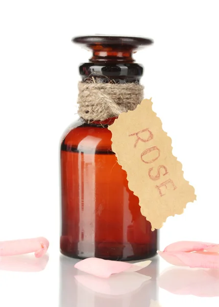 Bottle of oil and rose petals isolated on white — Stock Photo, Image