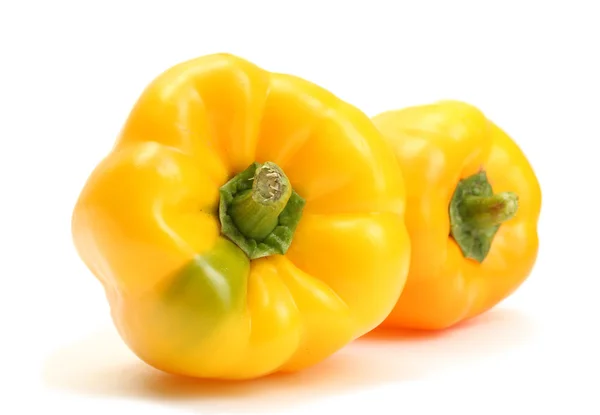 Fresh yellow bell peppers isolated on white — Stock Photo, Image
