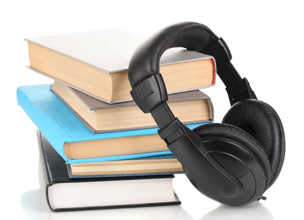 Auriculares en libros aislados en blanco —  Fotos de Stock