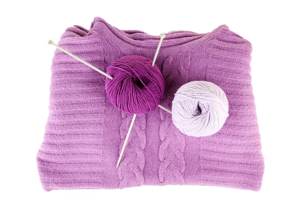 Purple sweater and a ball of wool isolated on white — Stock Photo, Image