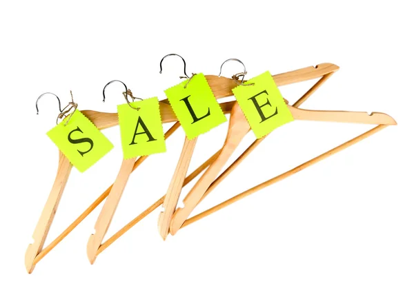 Coat hangers with sale tag isolated on white background — Stock Photo, Image