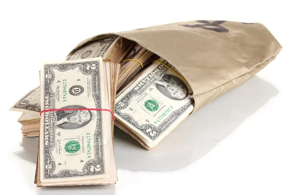 Bolsa con pilas de dólares aislados en blanco — Foto de Stock