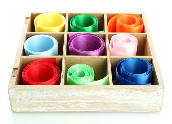 Bright silk ribbons in wooden box, isolated on white — Stock Photo, Image