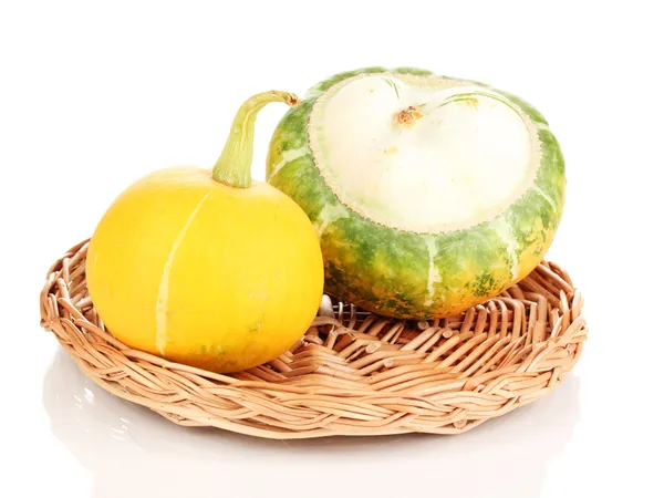 Two pumpkins on wicker mat isolated on white — Stock Photo, Image
