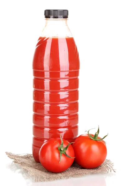 Tomato juice in bottle on sackcloth isolated on white — Stock Photo, Image