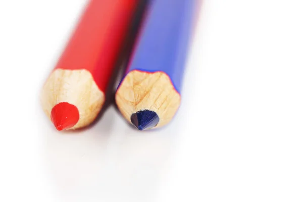 Red and blue pencils close-up isolated on white — Stock Photo, Image
