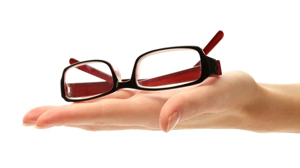 Óculos na mão feminina, isolados em branco — Fotografia de Stock