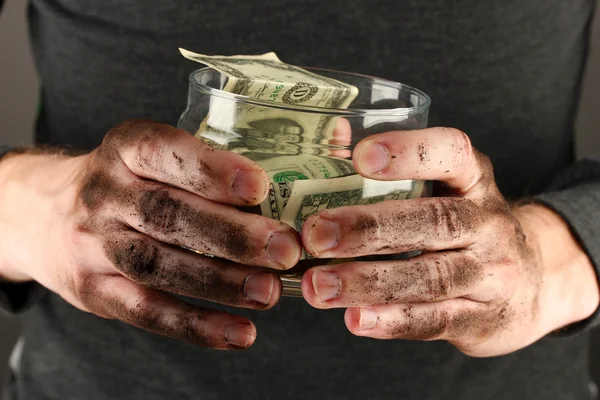 Homeless holds bank with money, close-up — Stock Photo, Image