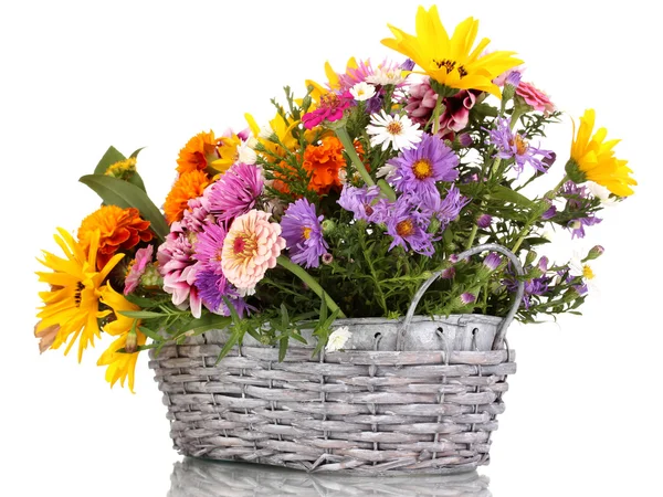 Beautiful bouquet of bright flowers in basket isolated on white — Stock Photo, Image