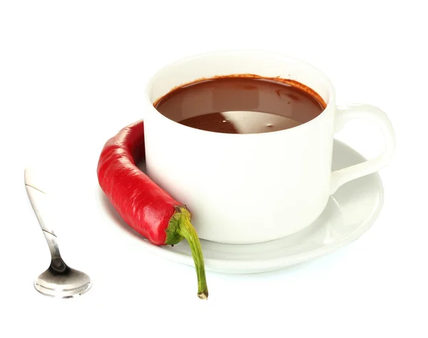 White cup with hot chocolate and chili pepper isolated on white Stock Image