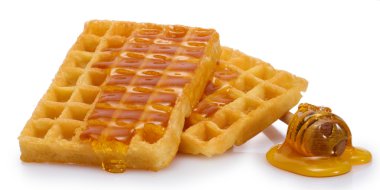 Belçika waffle üzerine beyaz izole bal ile