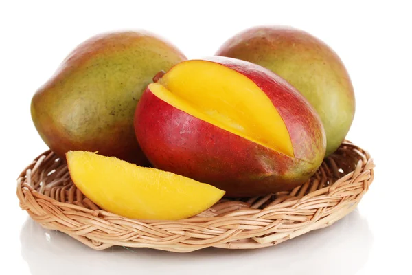 Ripe appetizing mango on wicker cradle isolated on white — Stock Photo, Image