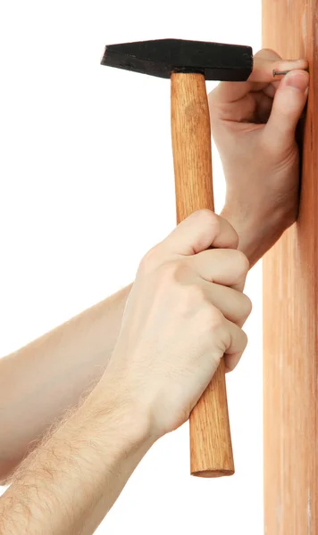 Muž ruce hřebík a kladivo — Stock fotografie
