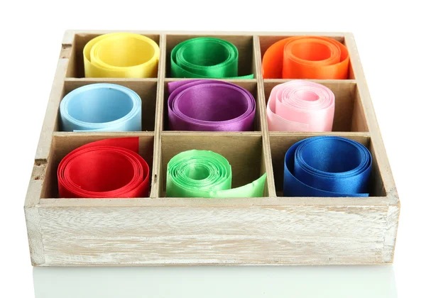 Bright silk ribbons in wooden box, isolated on white — Stock Photo, Image