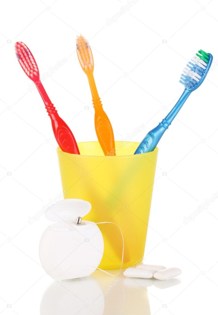 Toothbrushes, chewing gum and dental floss isolated on white Stock