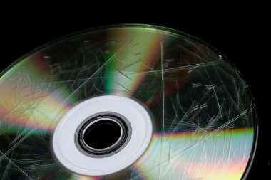 Defective disk with information isolated on black clipart