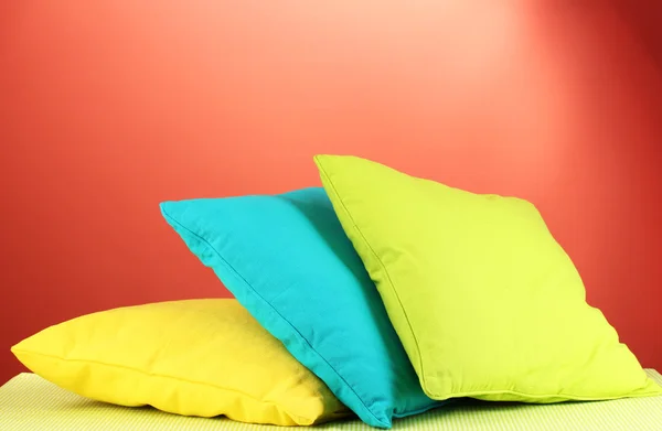 Pillows on red background — Stock Photo, Image