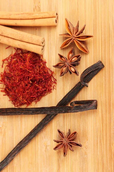 Fragrant spices on wooden background close-up