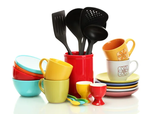 Bright empty bowls, cups and kitchen utensils isolated on white — Stock Photo, Image