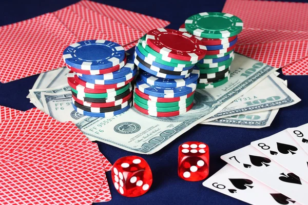 The blue poker table with cigars, poker chips, playing cards and dollars cl — Stock Photo, Image