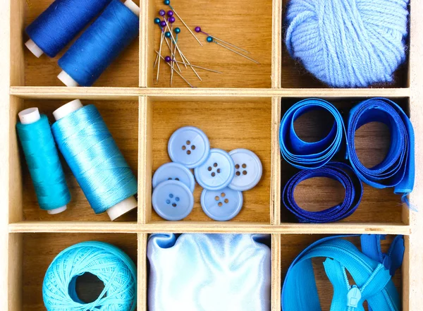 Material for sewing in wooden box closeup — Stock Photo, Image