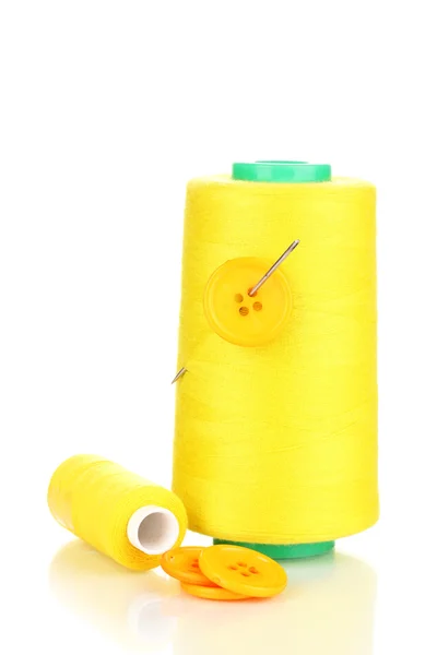 Yellow bobbin with needle and buttons isolated on white — Stock Photo, Image