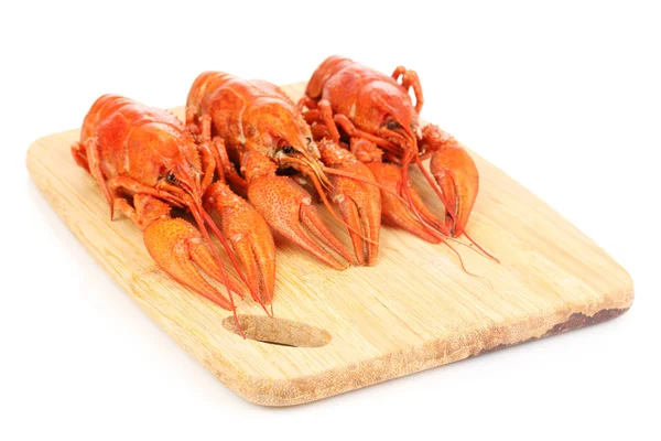Tasty boiled crayfishes on chopping board isolated on white — Stock Photo, Image