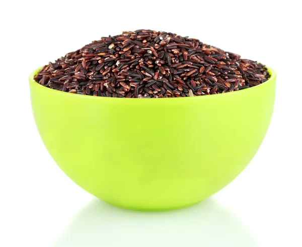 Чорний рис в зеленій тарілці, ізольований на білому — стокове фото