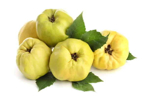 Sweet quinces with leaves, isolated on white — Stock Photo, Image