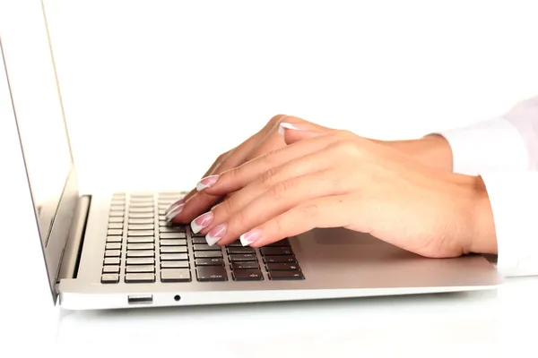 Hands typing on laptop keyboard close up Stock Picture