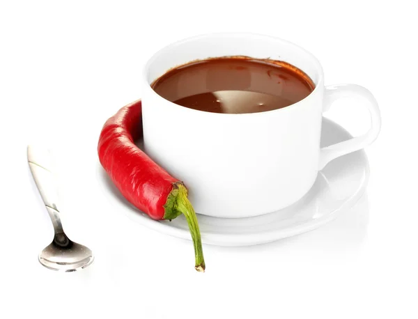 White cup with hot chocolate and chili pepper isolated on white Stock Picture