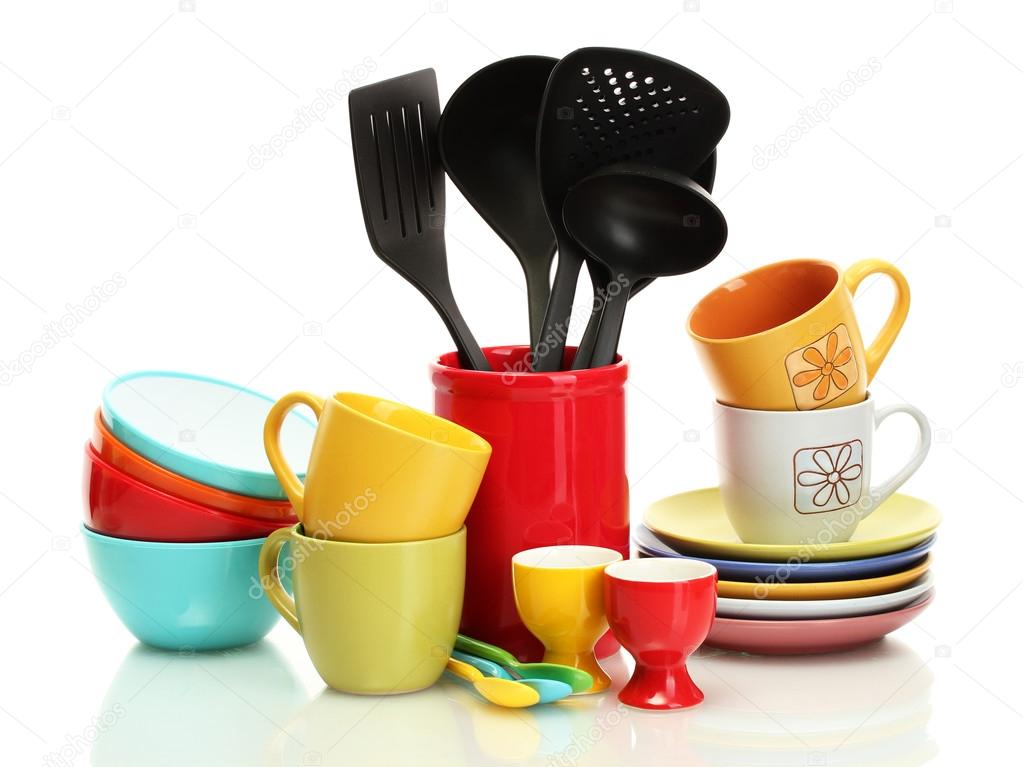 Bright empty bowls, cups and kitchen utensils isolated on white
