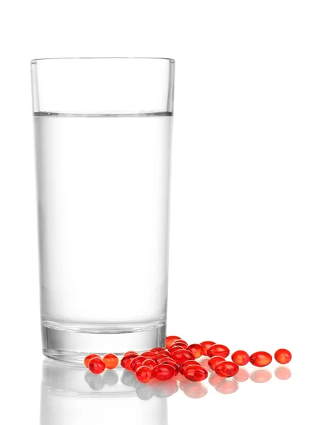 A glass of water and pills isolated on white close-up — Stock Photo, Image