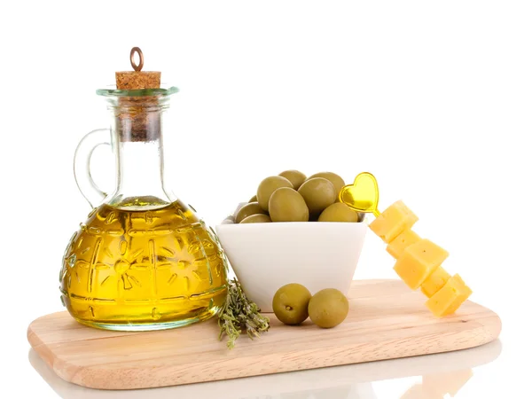 Green olives in white bowl with rosemary,olive oil and cheese on board isol — Stock Photo, Image