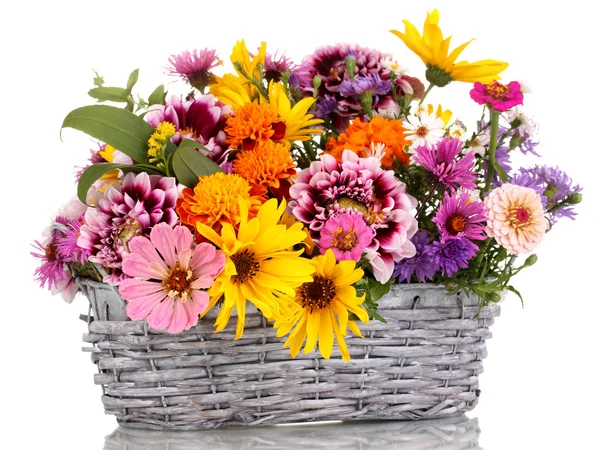 Beautiful bouquet of bright flowers in basket isolated on white — Stock Photo, Image