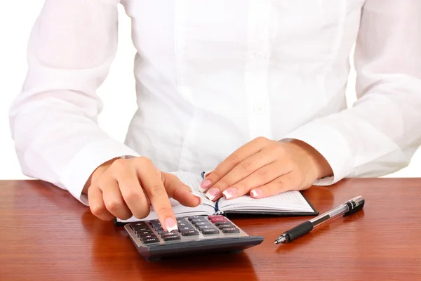 Woman's hands counts on the calculator, close-up — Stock Photo, Image