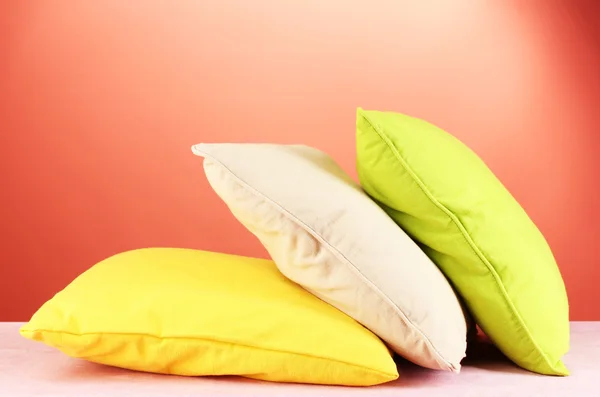 Pillows on red background — Stock Photo, Image