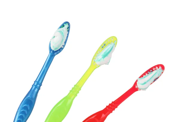 Toothbrushes in glass isolated on white — Stock Photo, Image