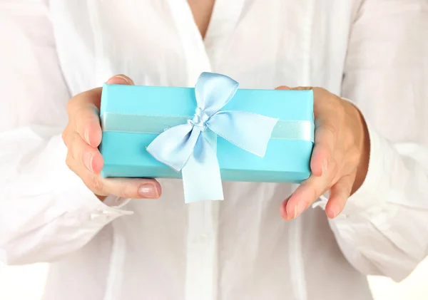Woman holds a box with a gift on white background close-up — Stock Photo, Image