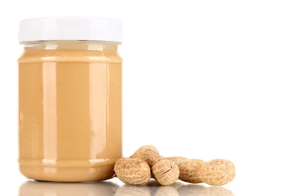 Delicious peanut butter in jar of peanut near isolated on white — Stock Photo, Image