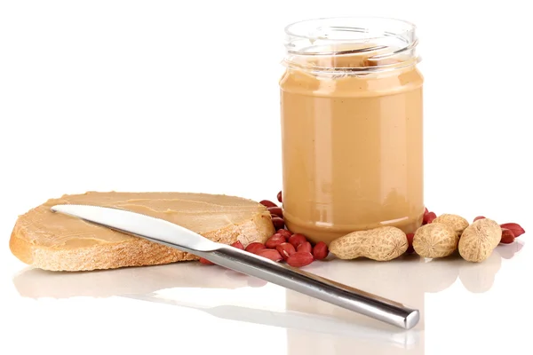 Delicious peanut butter in jar with sandwich isolated on white — Stock Photo, Image